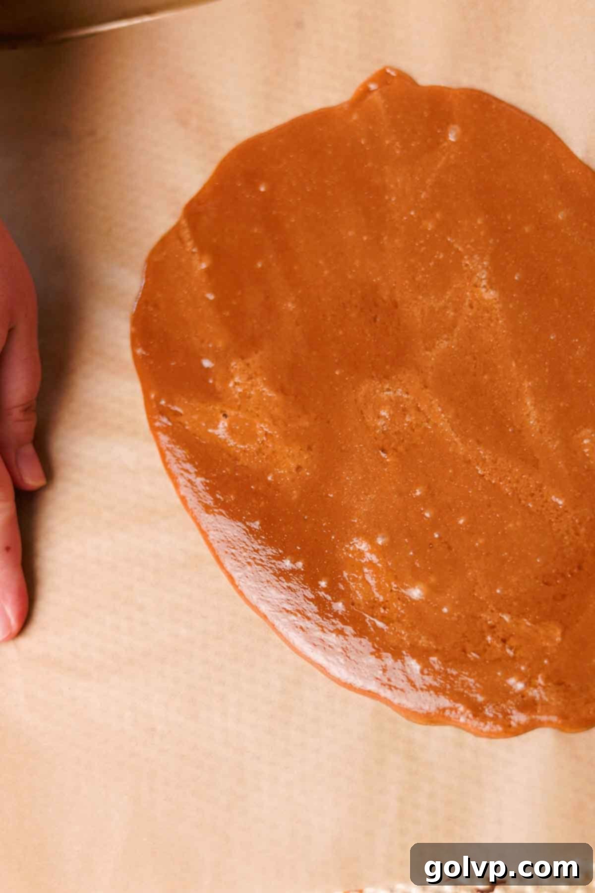 Heavenly Toffee Cookies: Our Foolproof Homemade Toffee Secret 8 spreading toffee on baking sheet