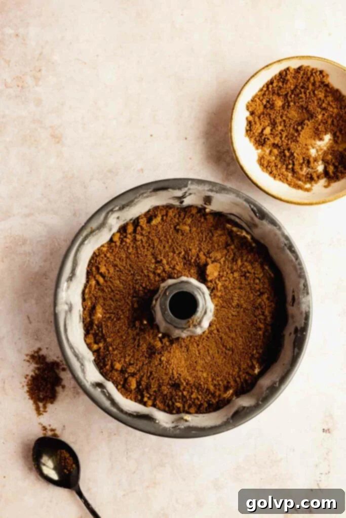 layering the cinnamon sugar into the bundt pan