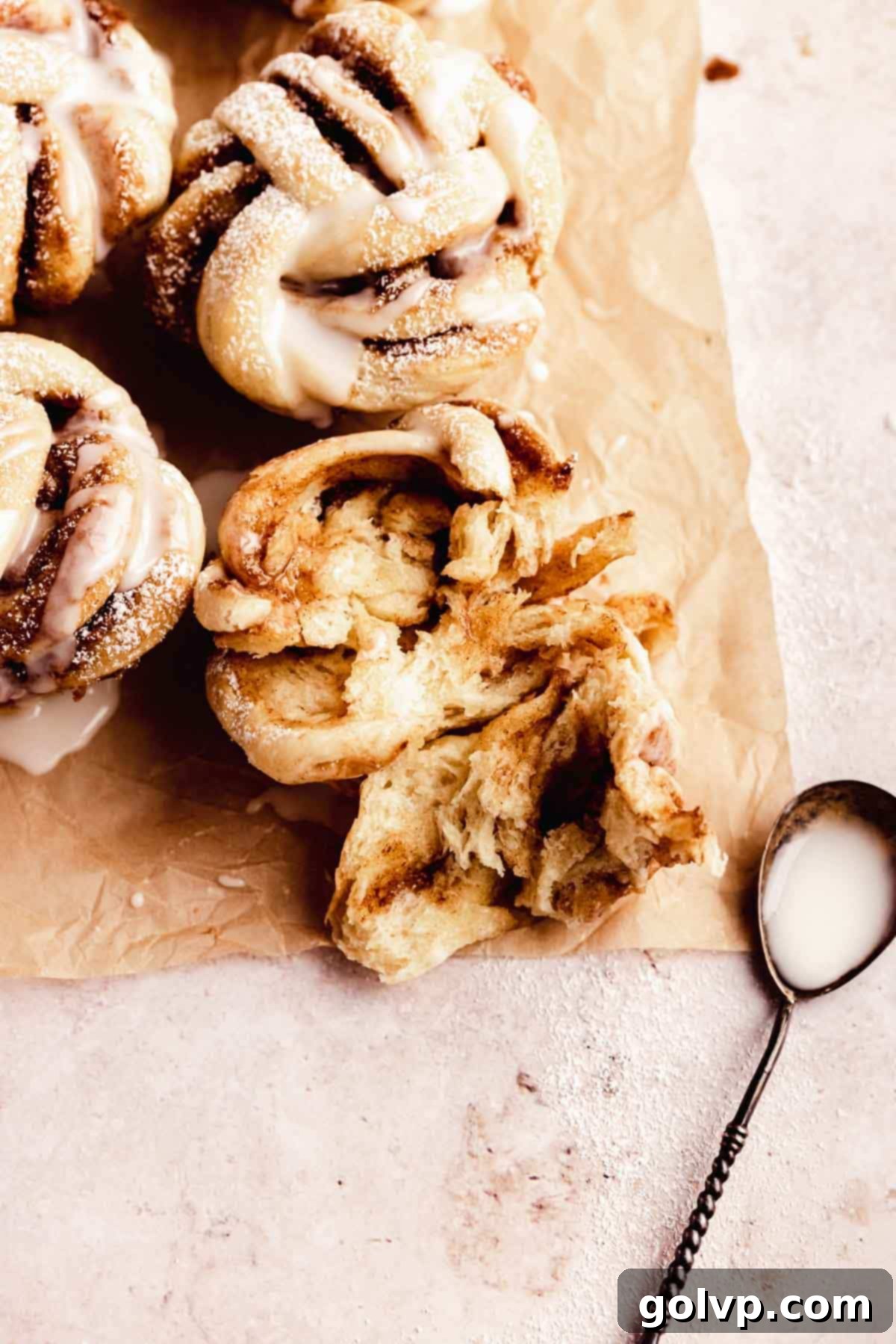 Cinnamon Swirl Delights 3 Close-up of a braided twisted cinnamon roll, showing the layers and gooey interior