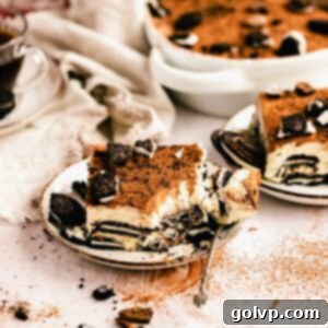 Oreo Tiramisu Delight 12 Taking a bite of rich Oreo Tiramisu on a plate, highlighting the creamy texture and layers.