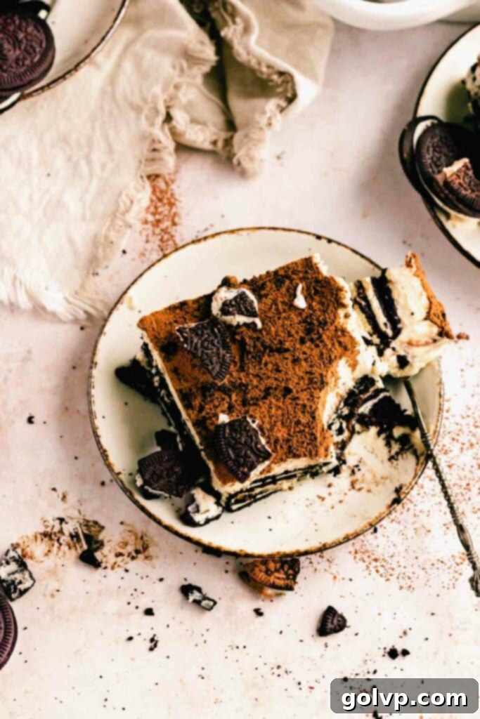 Oreo Tiramisu Delight 3 Close-up of a spoon scooping out a generous portion of Oreo Tiramisu, highlighting its creamy layers and chocolatey goodness.