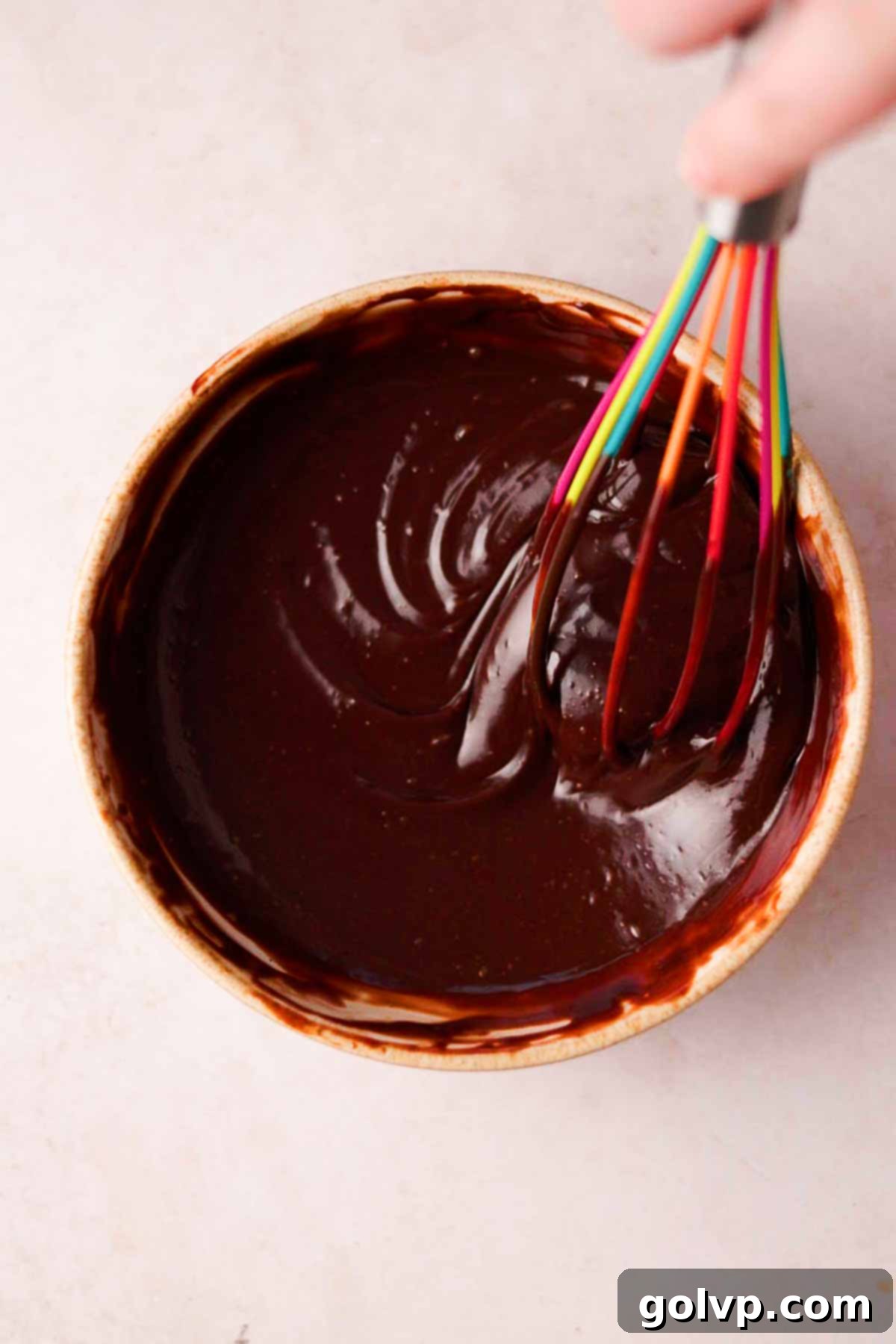 whisking chocolate nutella ganache with silicone whisk