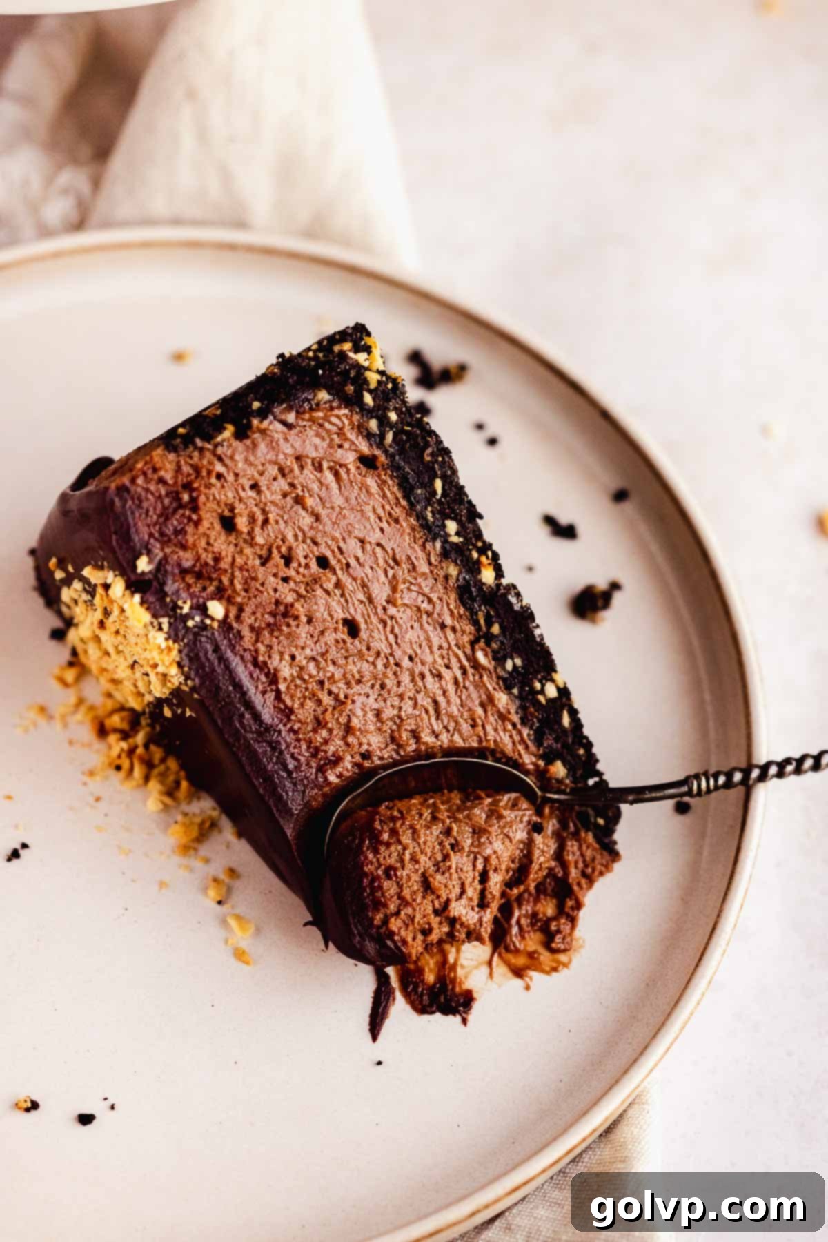 chocolate nutella cheesecake slice on plate with spoon