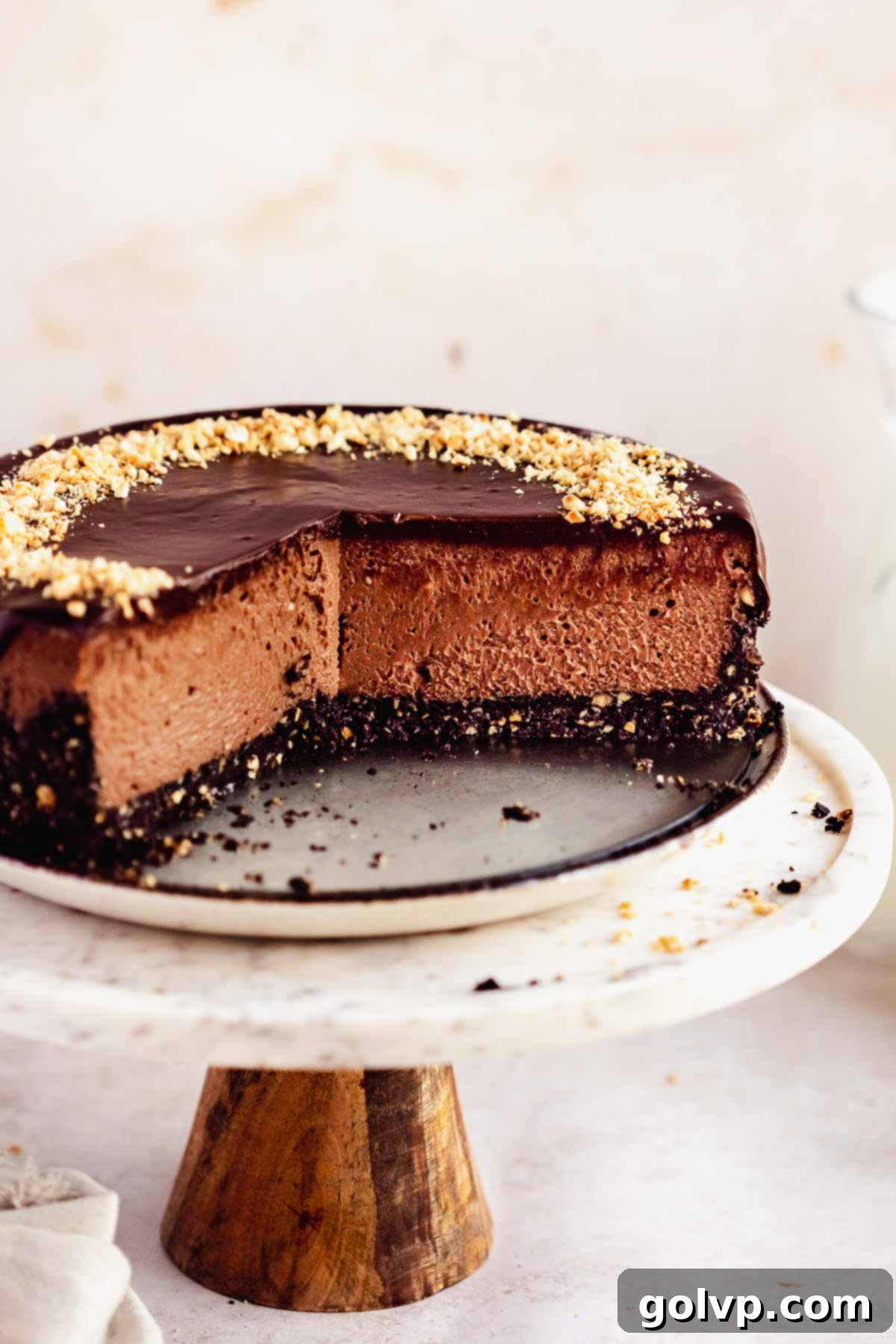 sliced nutella cheesecake on cake stand