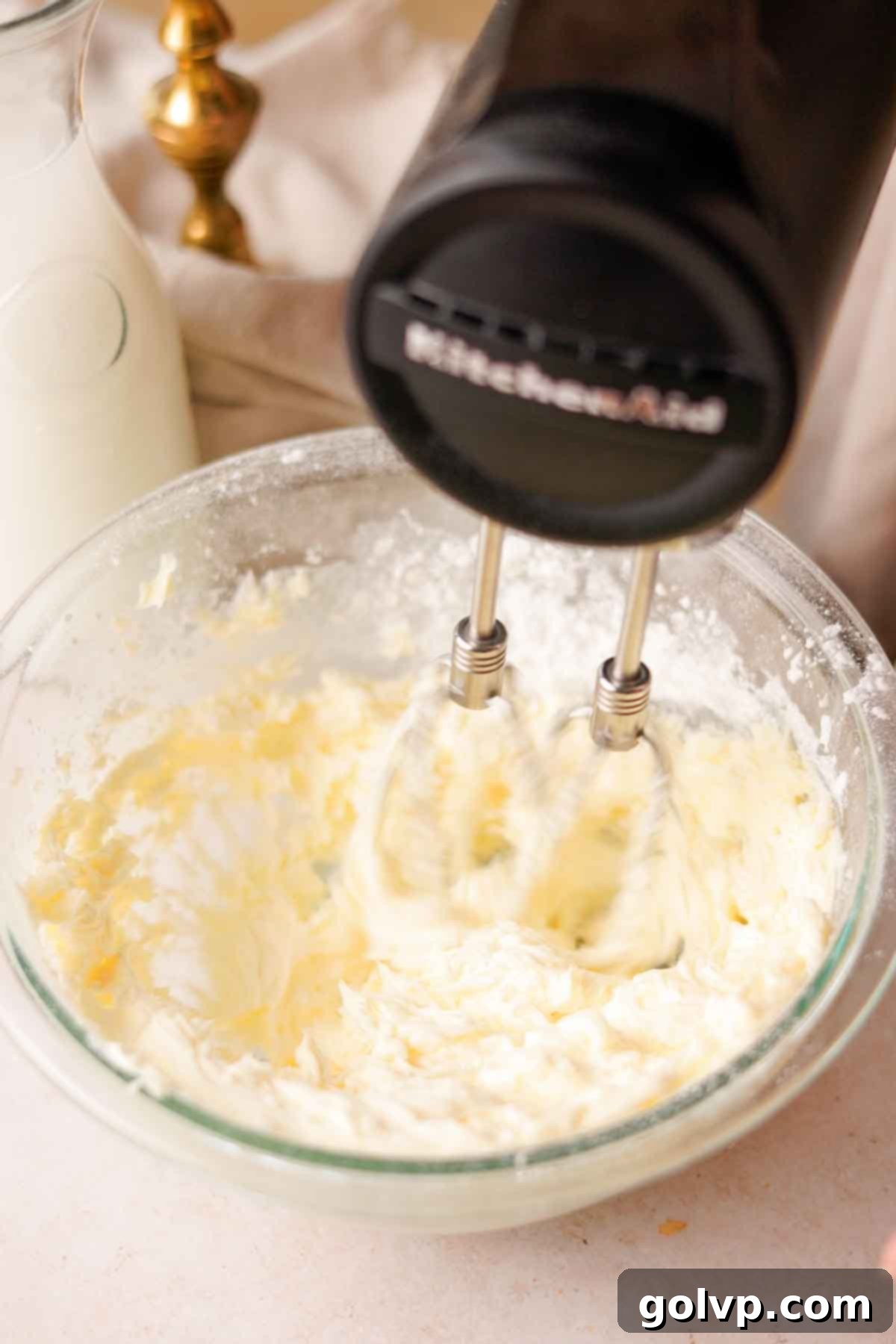 beating butter and powdered sugar until creamy for the nutella frosting