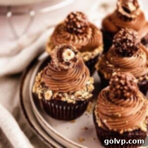 chocolate cupcakes with nutella frosting topped with ferrero rocher chocolate