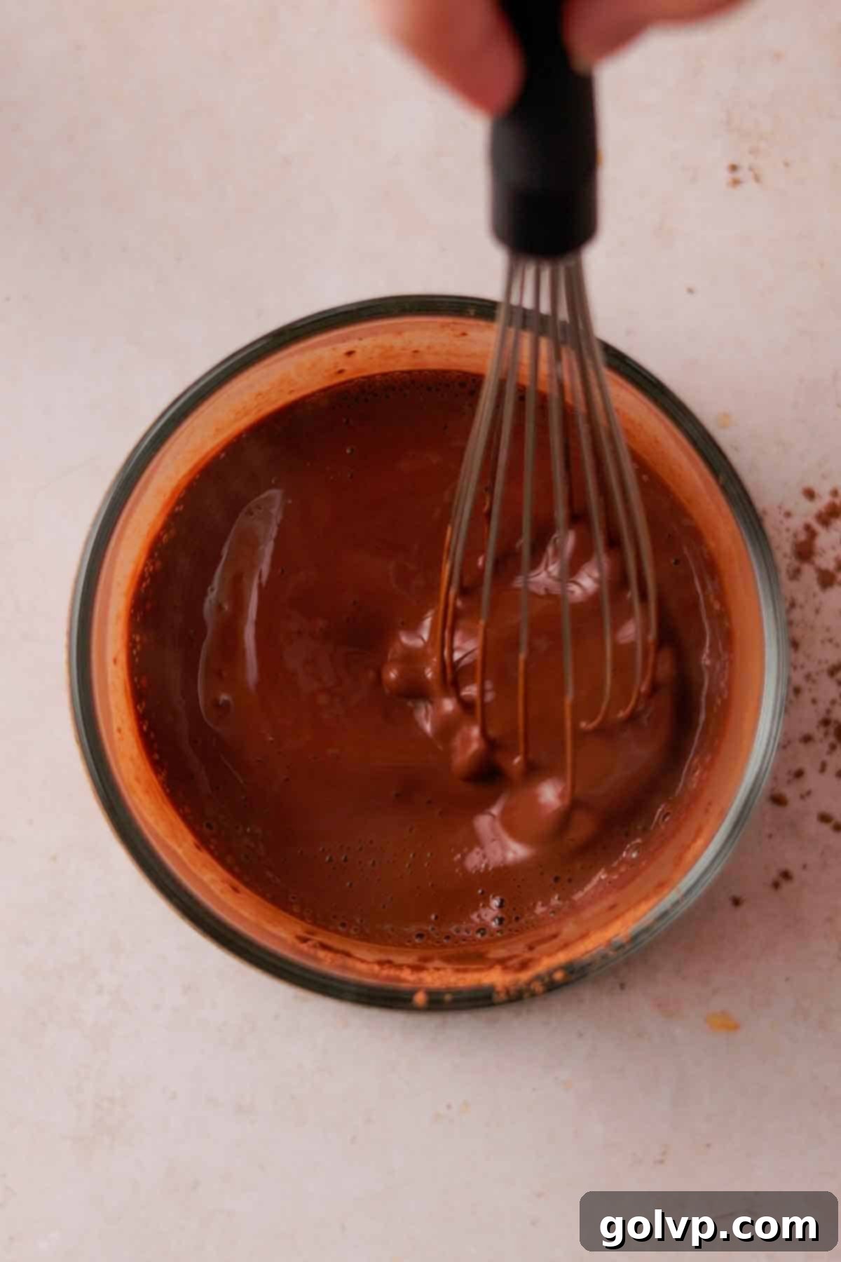 whisking cocoa powder and hot water to bloom
