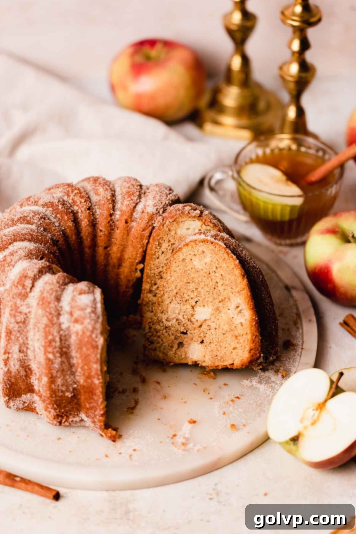 Spiced Autumn Apple Bundt 2 sliced apple cider bundt cake on a plate