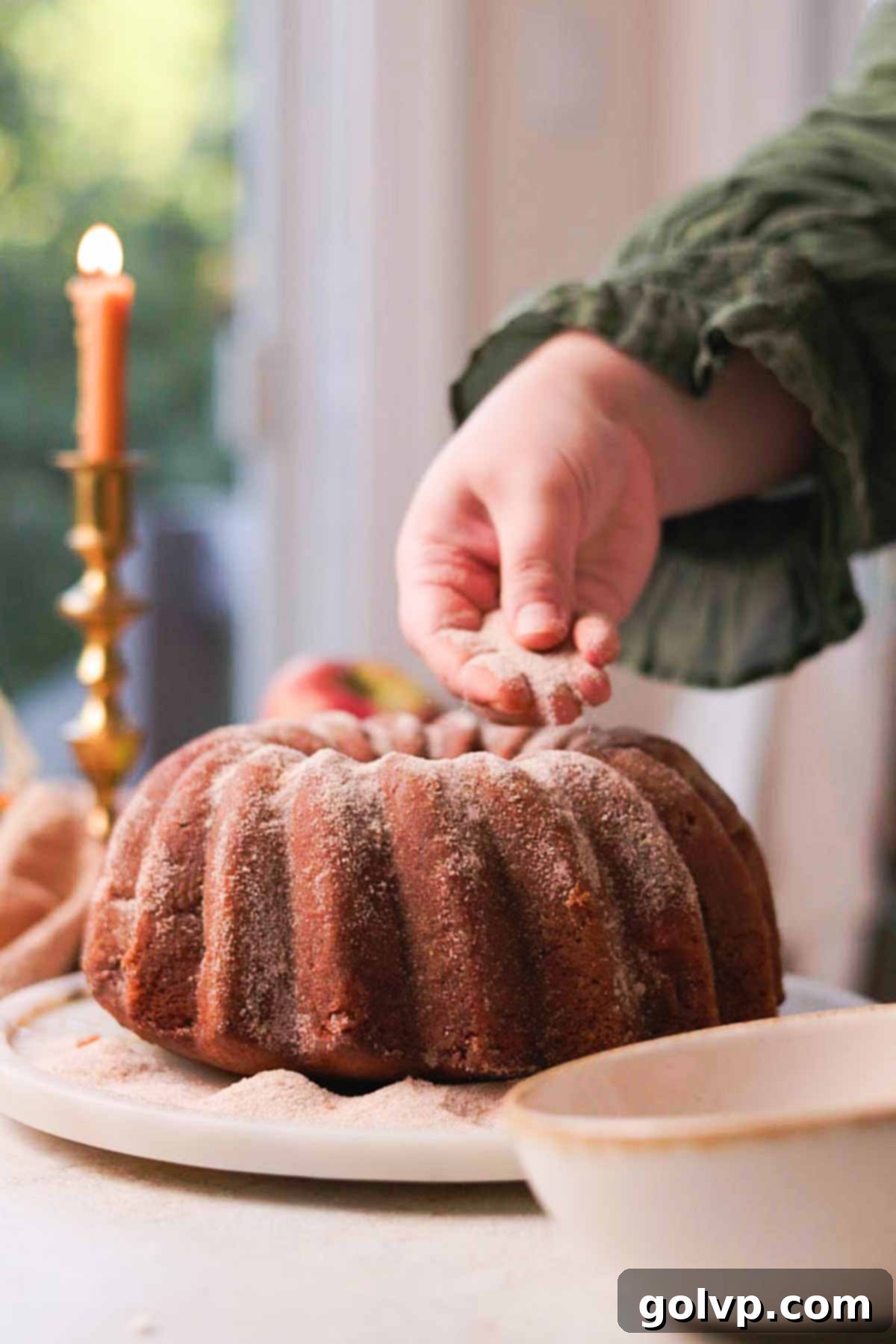 Spiced Autumn Apple Bundt 14 sprinkling sugar cinnamon mixture over bundt cake
