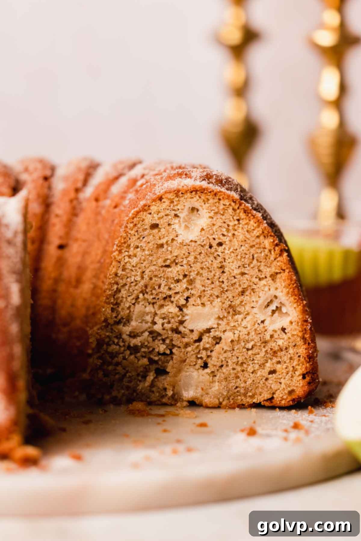 Spiced Autumn Apple Bundt 17 apple cider donut cake on a plate cross-section