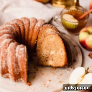 Spiced Autumn Apple Bundt 18 apple cider bundt cake sliced on a cake plate