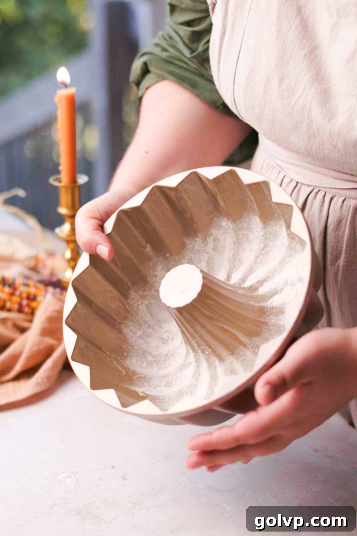 Spiced Autumn Apple Bundt 6 buttering and flouring the inside of a bundt cake pan