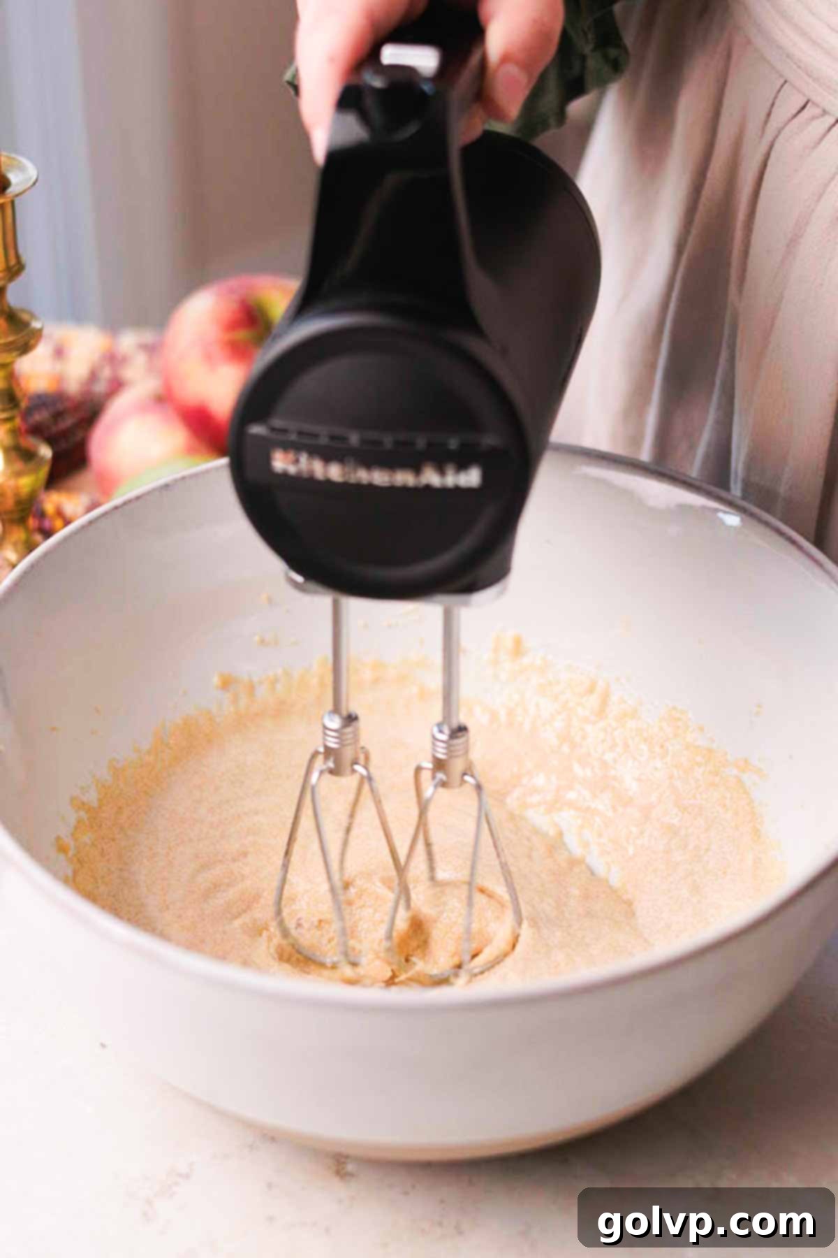 Spiced Autumn Apple Bundt 7 blending butter oil and sugar in a large bowl with a mixer