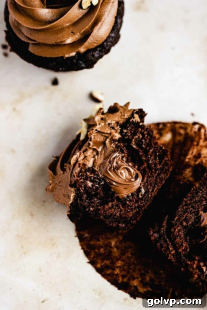 Chocolate cupcake filled with nutella, showcasing the rich filling and moist cake.