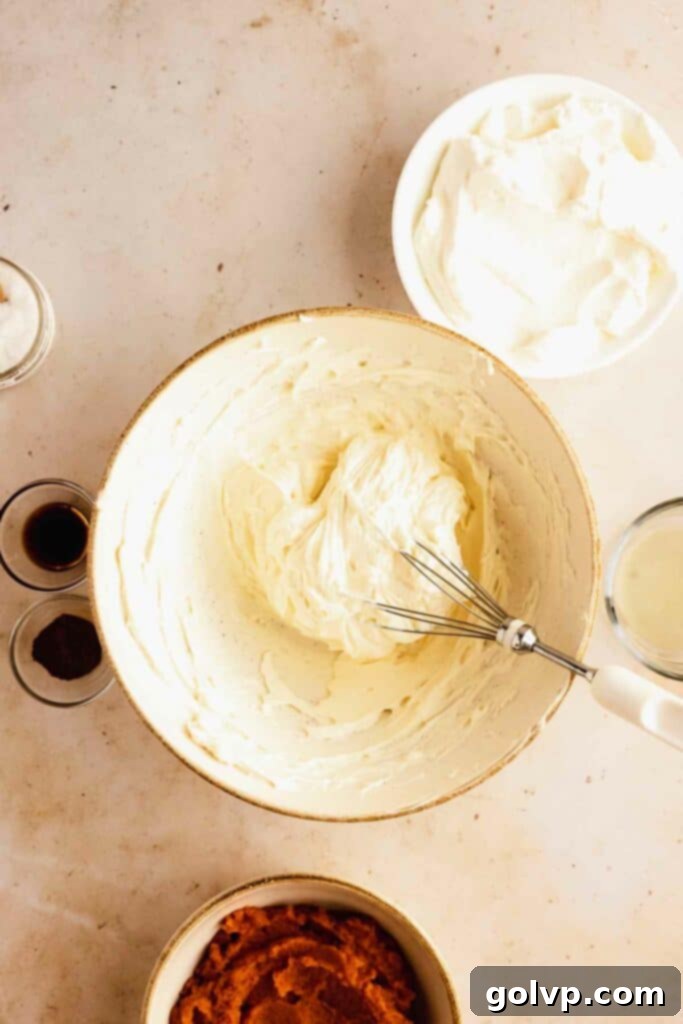 Easy No-Bake Pumpkin Cheesecake Bars 8 beating cream cheese until smooth