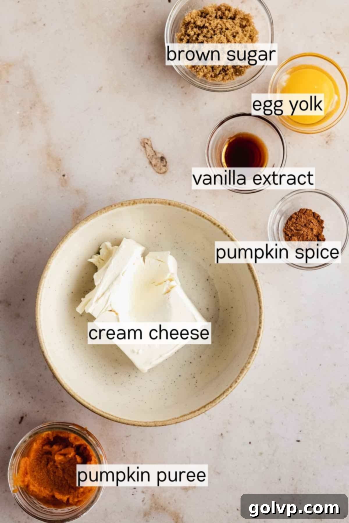 Decadent Pumpkin Cheesecake Cookies 4 brown sugar, egg yolk, vanilla extract, pumpkin spice, cream cheese, and pumpkin puree in little bowls