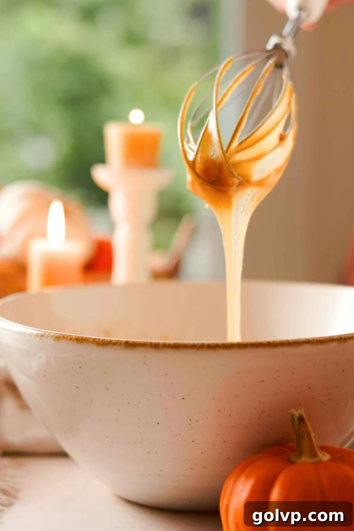 Decadent Pumpkin Cheesecake Cookies 5 wet ingredients for cookie dough falling off the whisk in ribbons