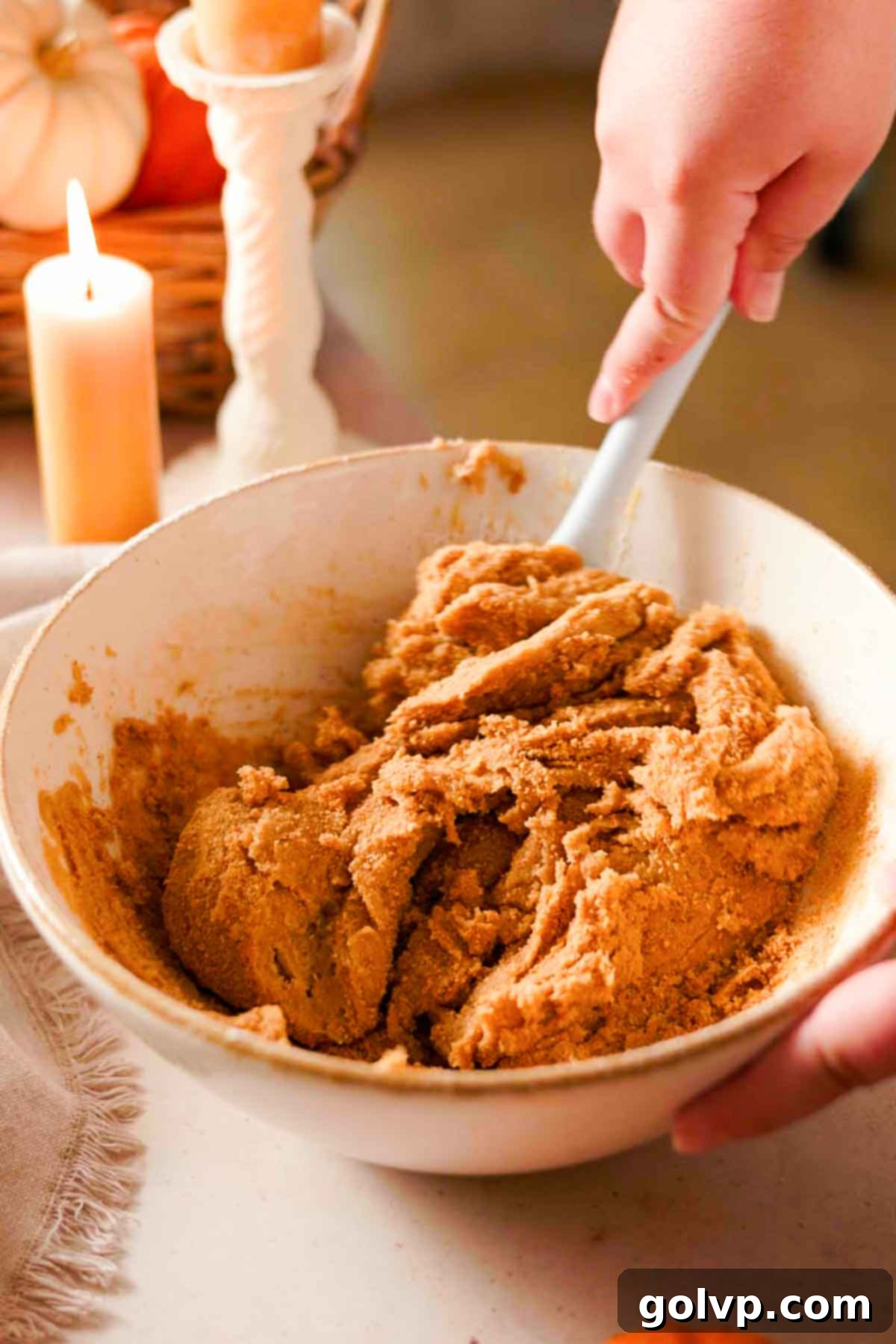 Decadent Pumpkin Cheesecake Cookies 7 folding graham cracker crumbs into cookie dough with a rubber spatula