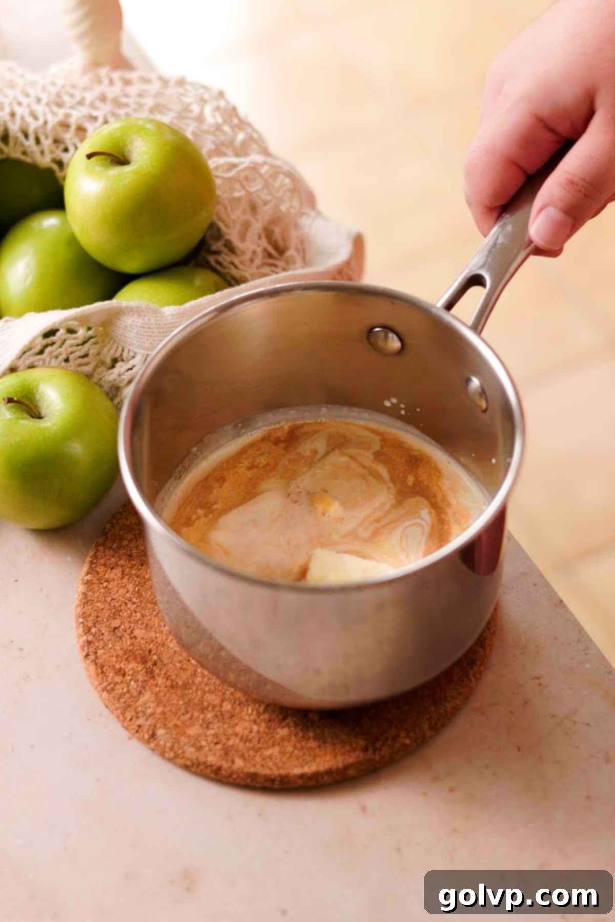 Melting cream, butter, salt, and vanilla in a small saucepan over low heat until simmering.