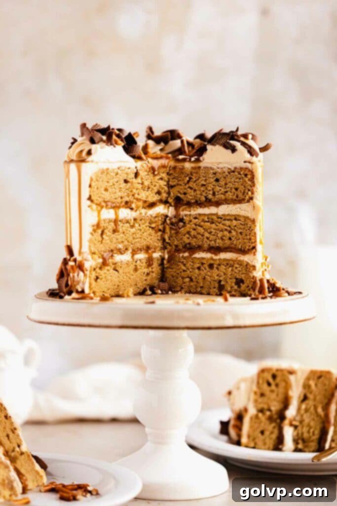 Cut open butterscotch cake slice revealing moist layers and creamy frosting