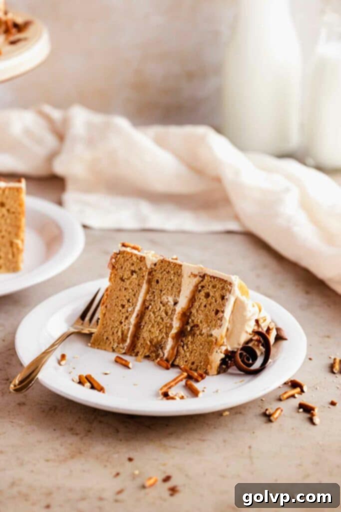 Serving a beautifully presented slice of butterscotch cake