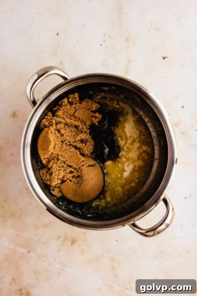 Combining butterscotch ingredients into saucepan for cooking