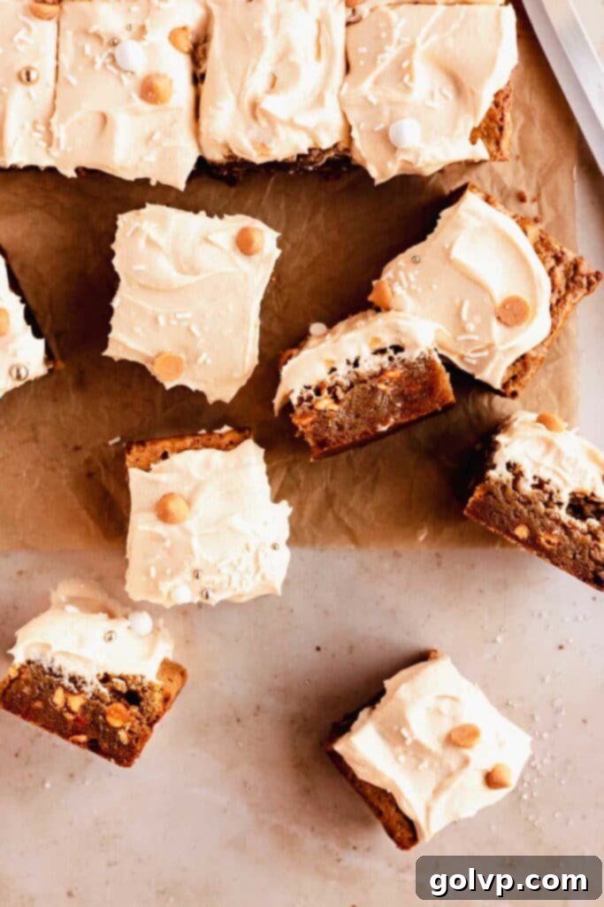 Cut blondies frosted with butterscotch cream cheese frosting