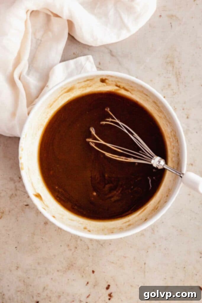 whisk sugar and melted butter until smooth