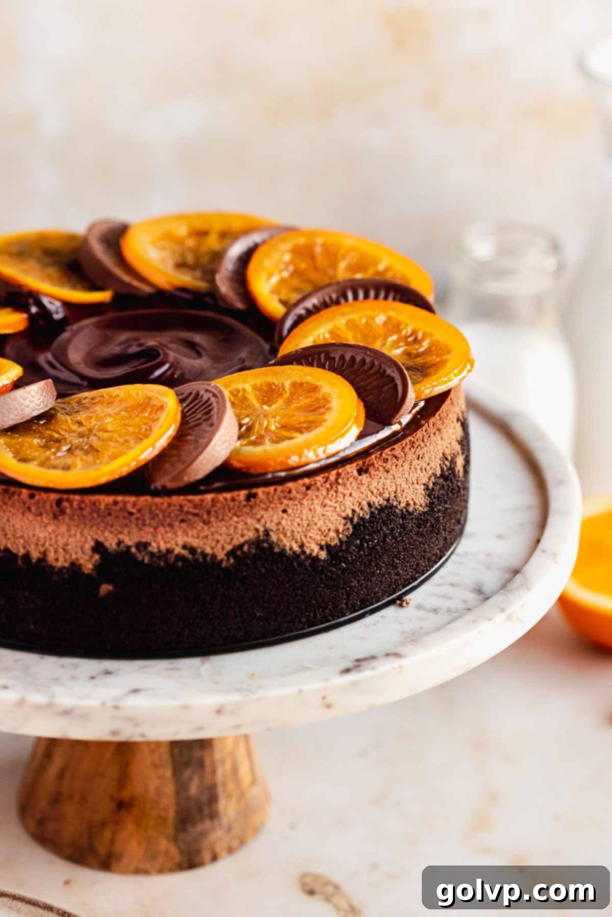 chocolate cheesecake with orange slices and terry's chocolate orange on top