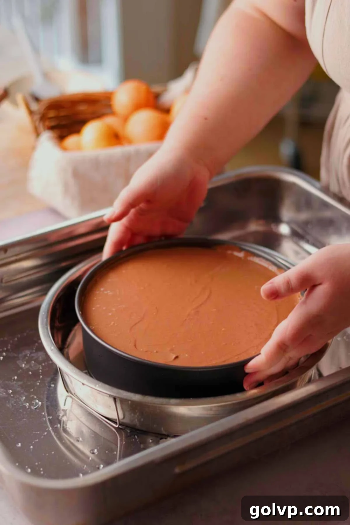 placing cheesecake into water bath