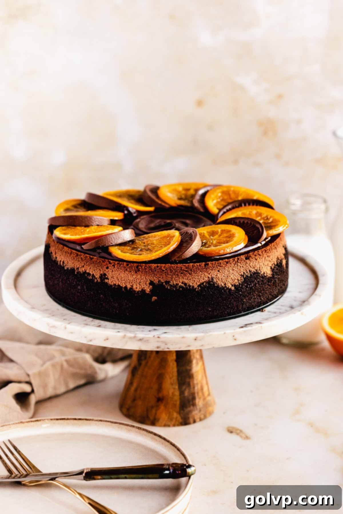 chocolate cheesecake decorated with terry chocolate orange and candied orange slices