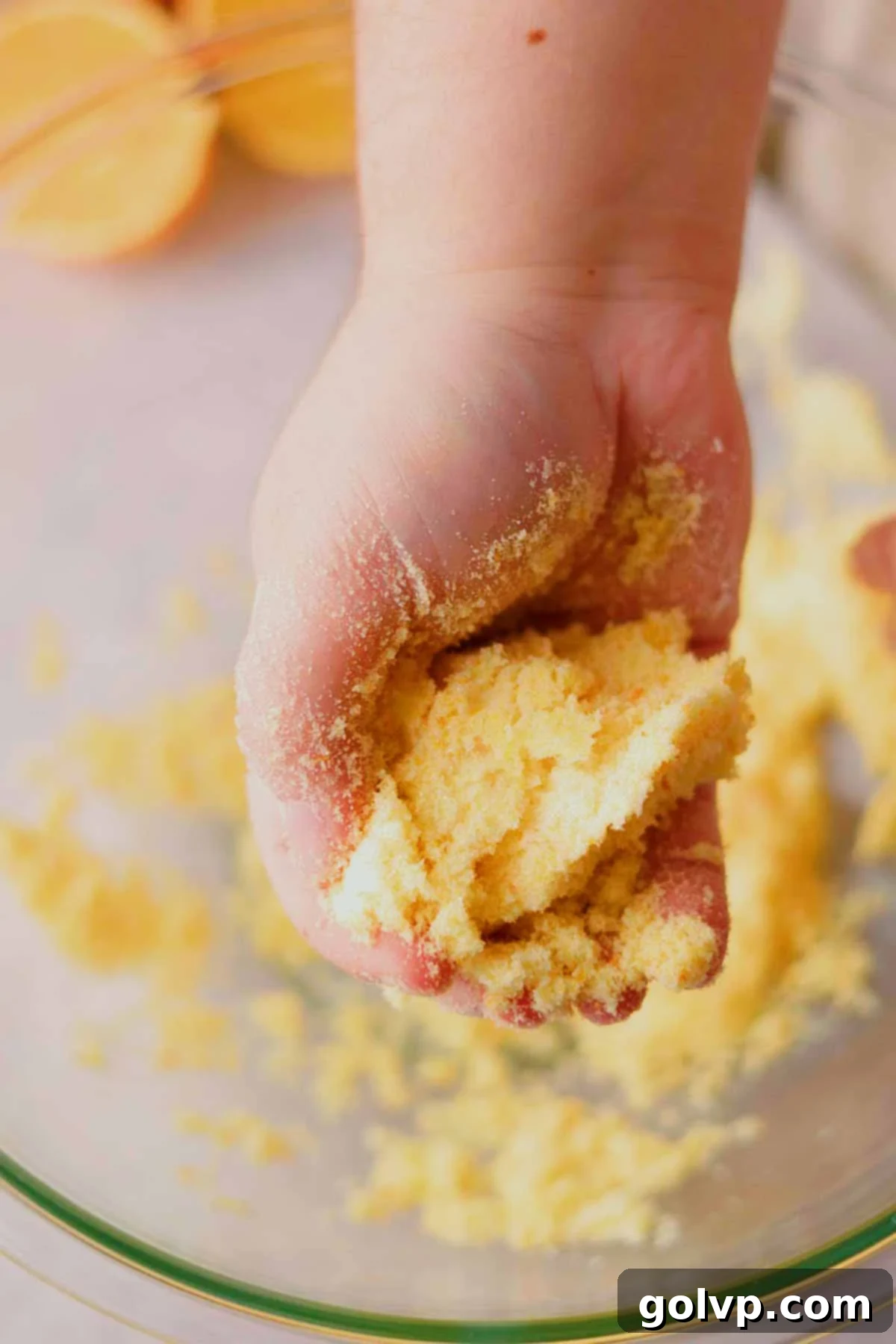 rubbing orange zest and sugar with your fingers