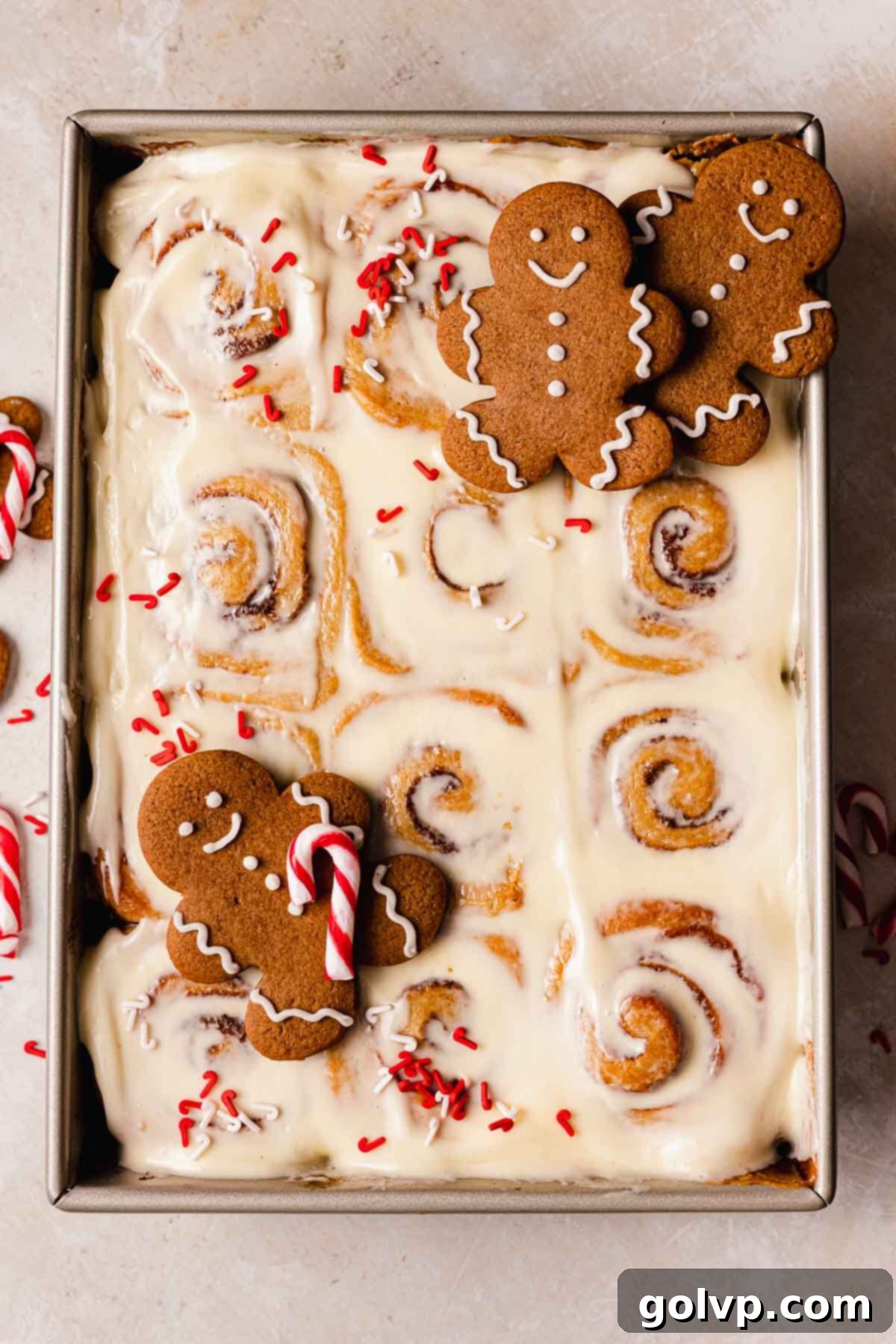 frosted gingerbread cinnamon rolls in baking pan