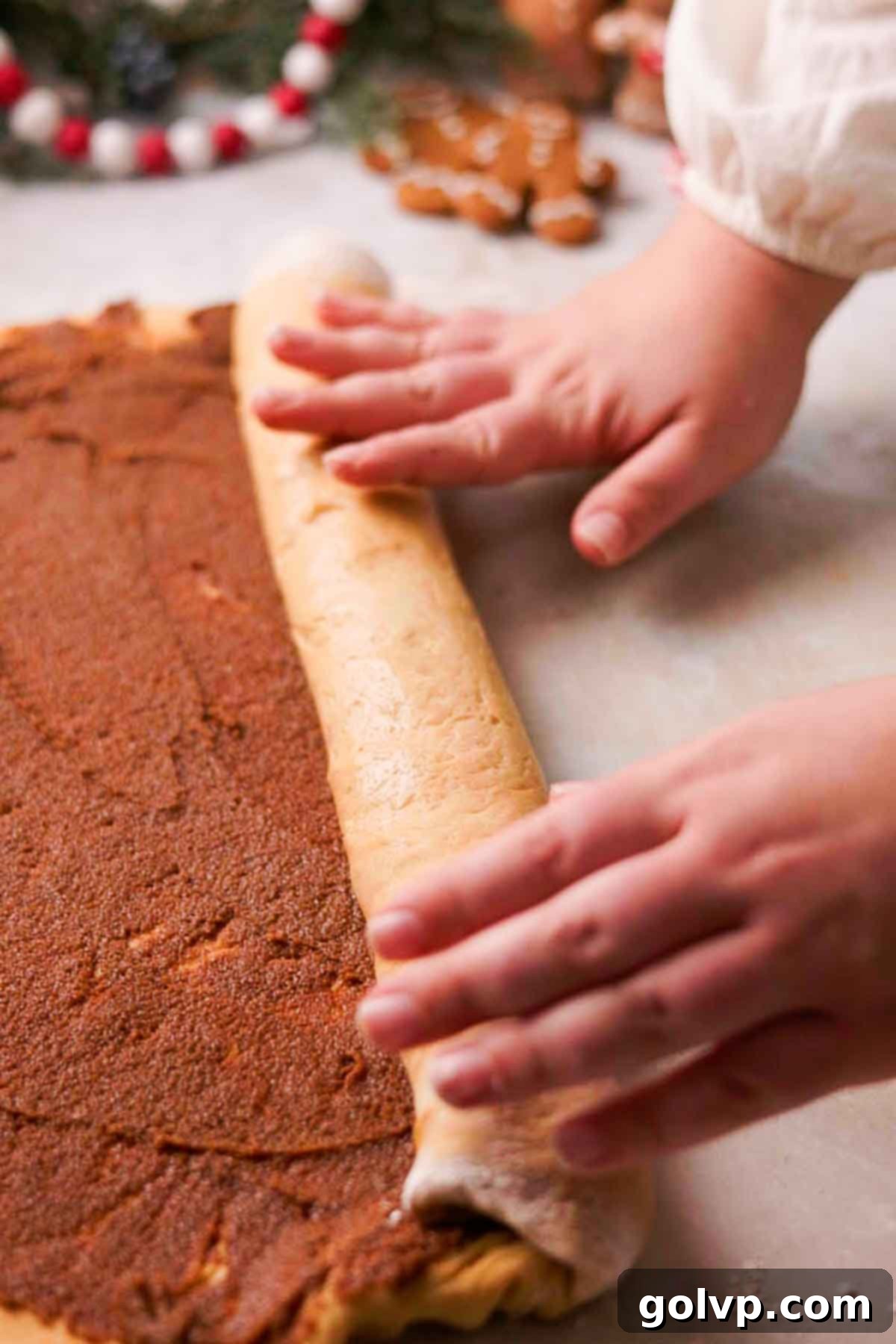 rolling gingerbread cinnamon rolls
