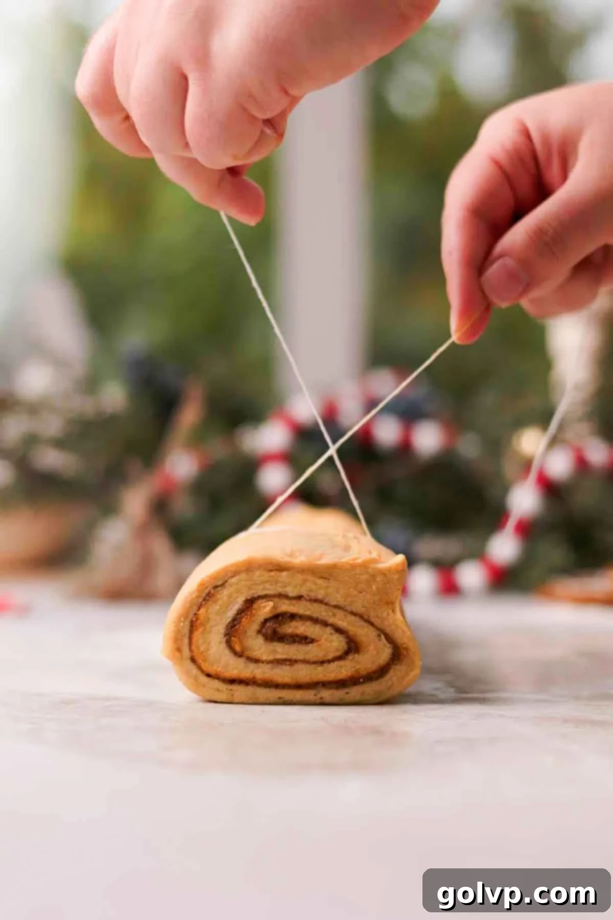 cutting cinnamon rolls with piece of string