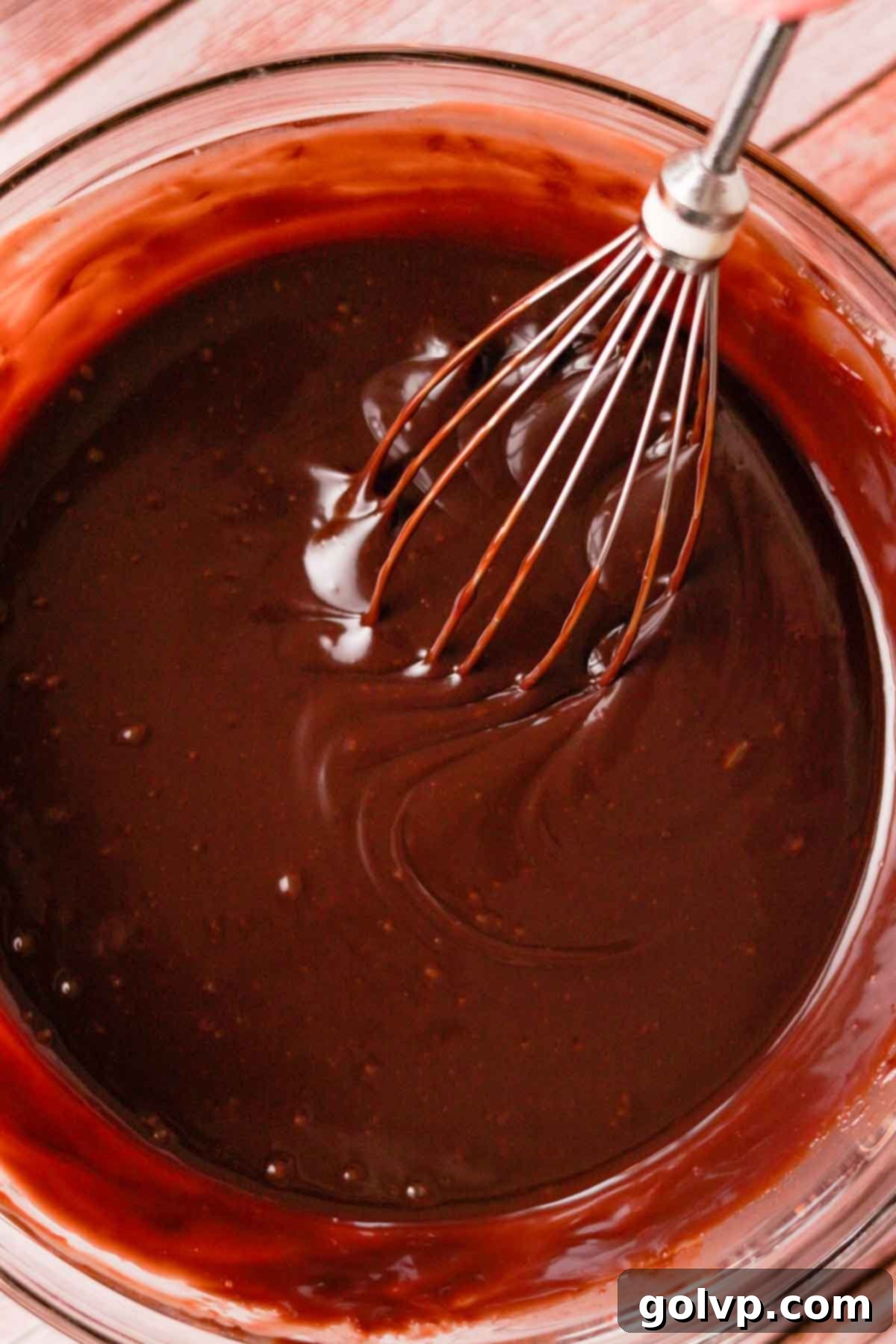 Melted milk chocolate ganache stirred with a wire whisk until smooth.