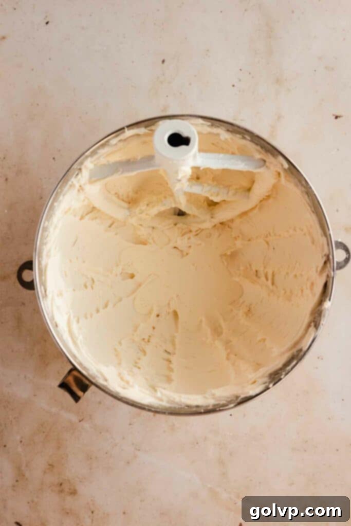 Classic Buttercream Sugar Cookies 12 Beating butter and powdered sugar until light and fluffy for buttercream