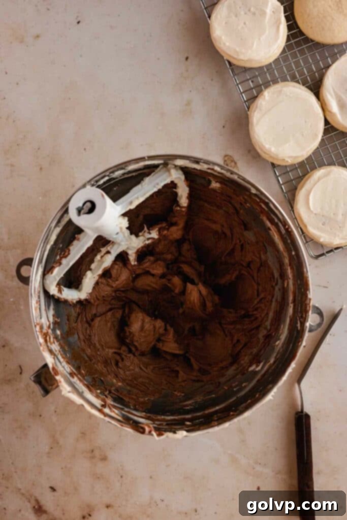 Classic Buttercream Sugar Cookies 14 Adding cocoa powder to vanilla buttercream to create chocolate frosting