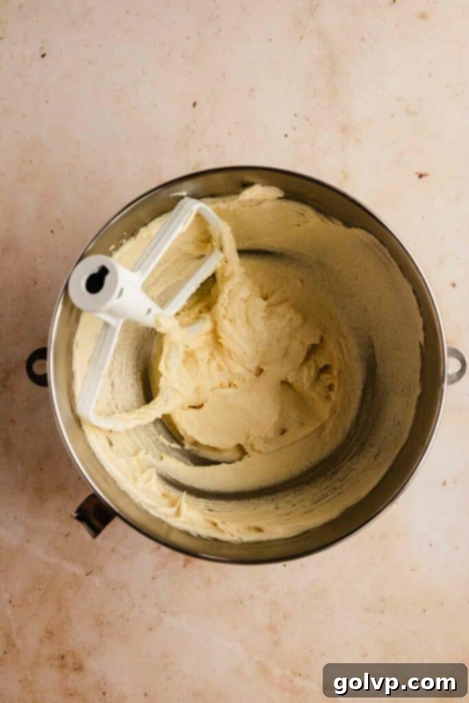 Classic Buttercream Sugar Cookies 7 Sugar cookie dough wet ingredients being mixed