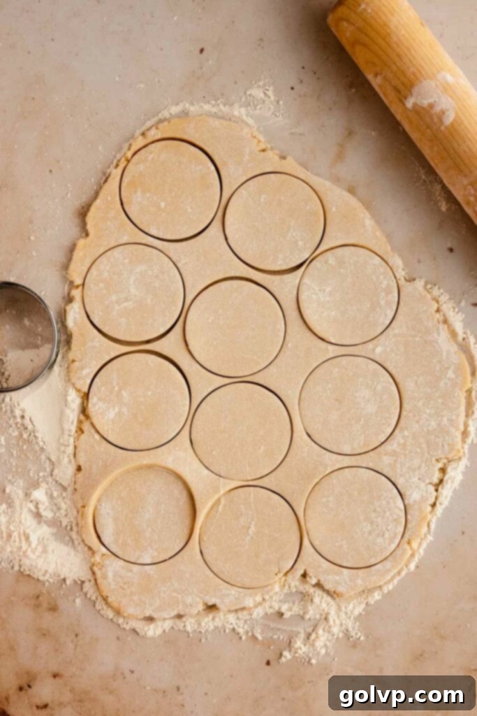 Classic Buttercream Sugar Cookies 9 Cutting out sugar cookies with a round cookie cutter