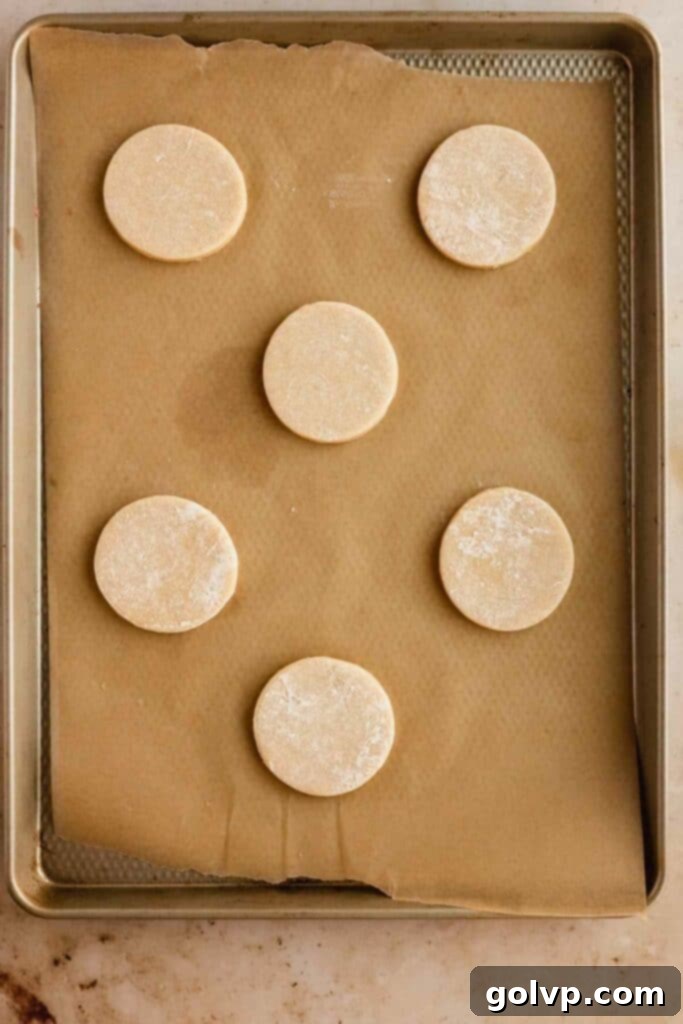 Classic Buttercream Sugar Cookies 10 Unbaked sugar cookies on a parchment-lined sheet