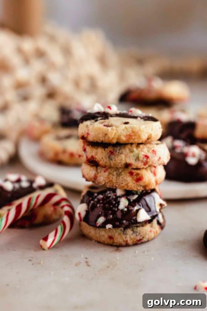 stack of peppermint shortbread cookies with candy canes