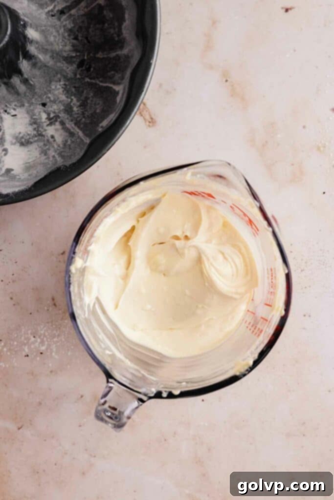 Smooth and creamy cream cheese swirl batter prepared for layering