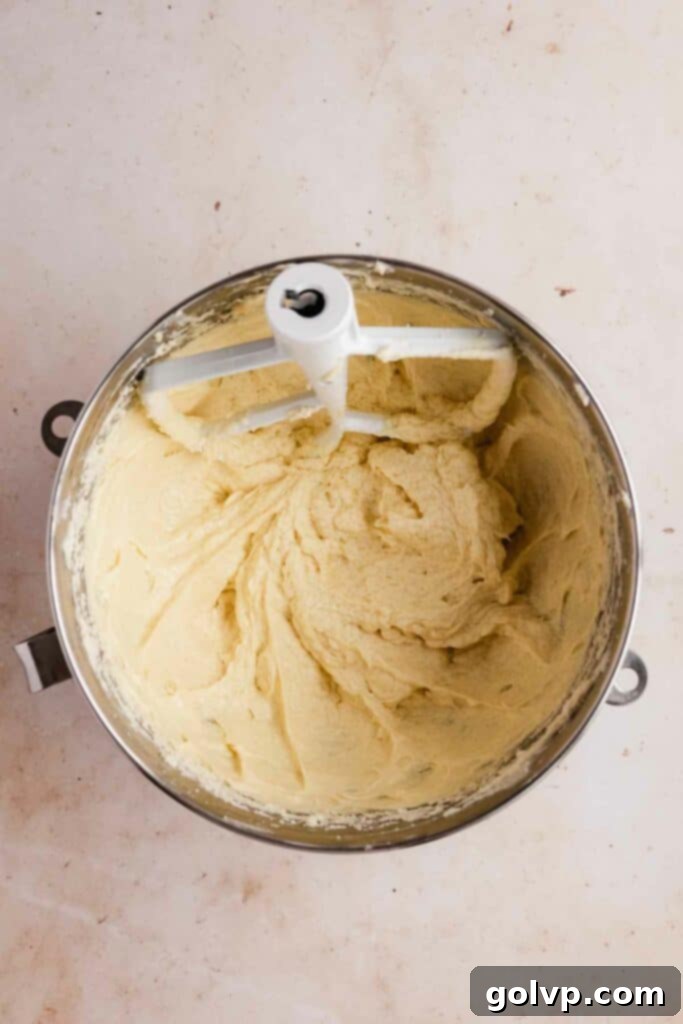 Creamed fats, sugar, and eggs for a moist red velvet bundt cake batter