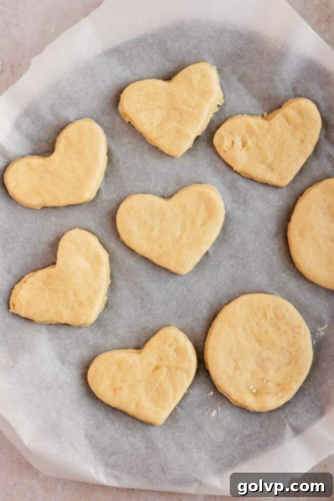 cut donut shapes on baking tray ready to rise