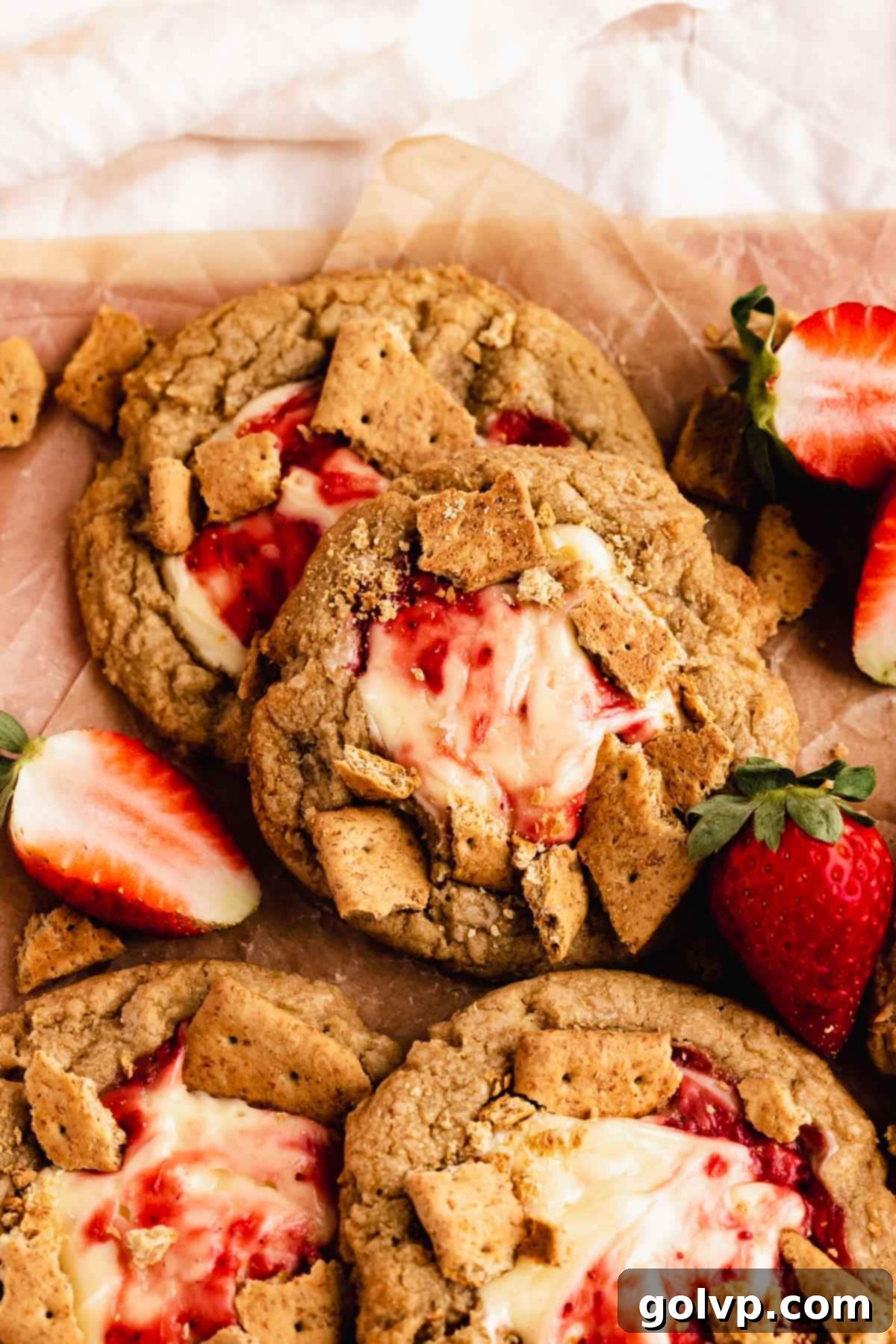 Decadent Strawberry Cheesecake Cookies 12 Baked strawberry cheesecake cookies with swirled filling and fresh strawberries on top
