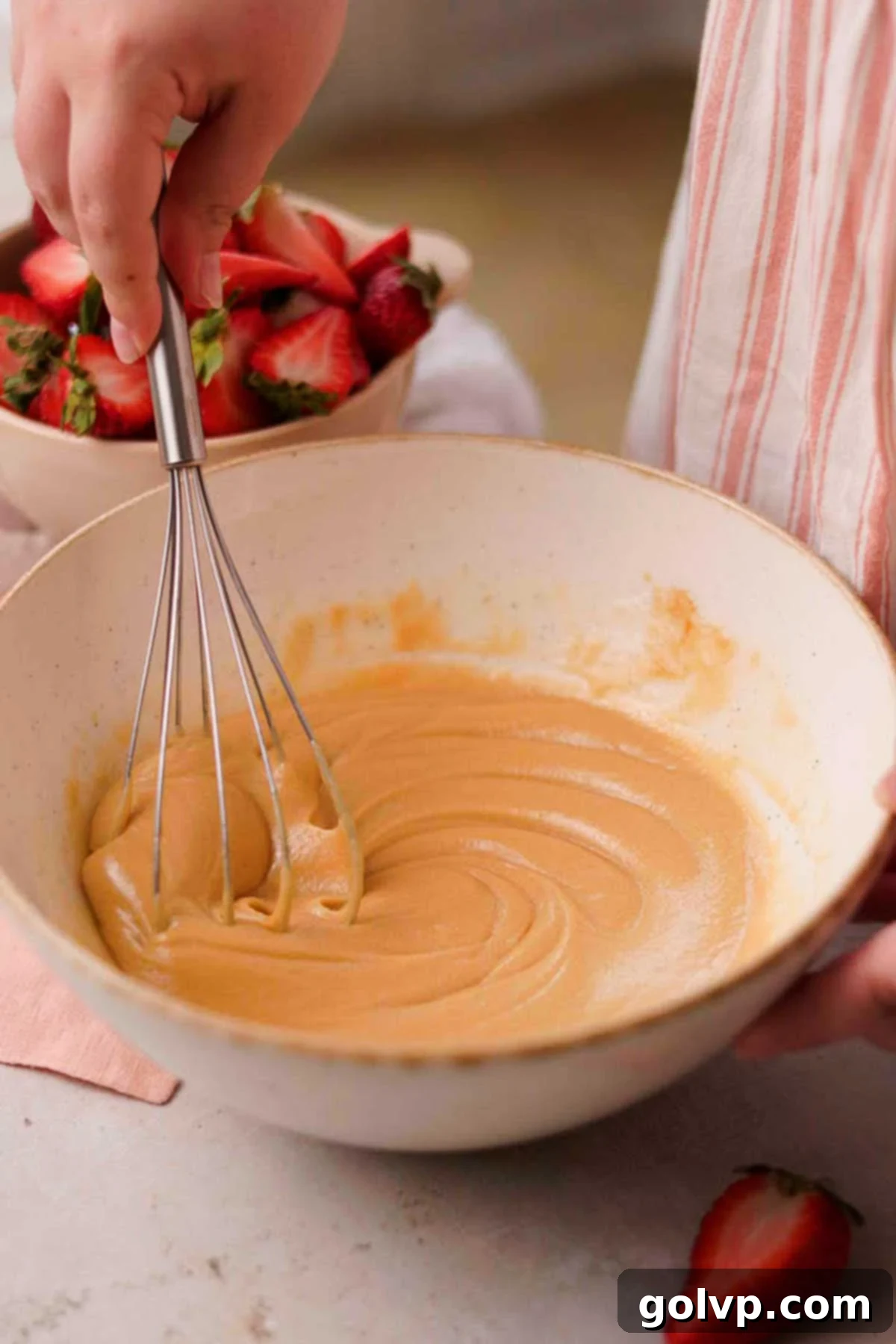 Decadent Strawberry Cheesecake Cookies 7 Whisking together brown sugar, granulated sugar, salt, and egg in a large mixing bowl
