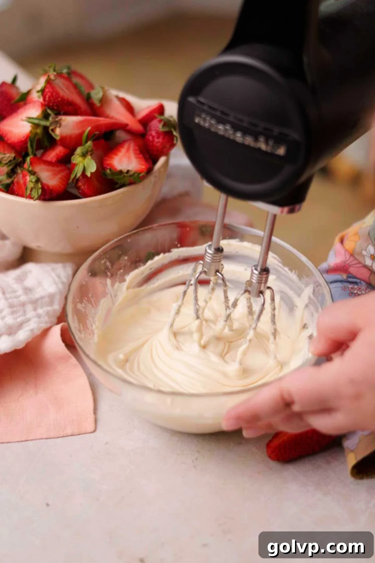 Decadent Strawberry Cheesecake Cookies 10 Beating cream cheese, sugar, vanilla, and egg together for the cheesecake filling in a glass bowl