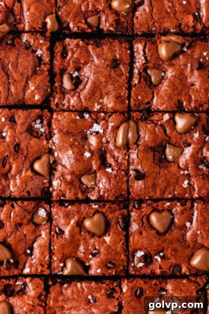 Close-up of red velvet brownies with a prominent crinkle top, emphasizing their delightful texture.