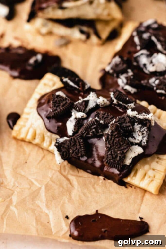 Homemade Oreo Pop Tart with a generous layer of chocolate icing and large crushed Oreo pieces on top.